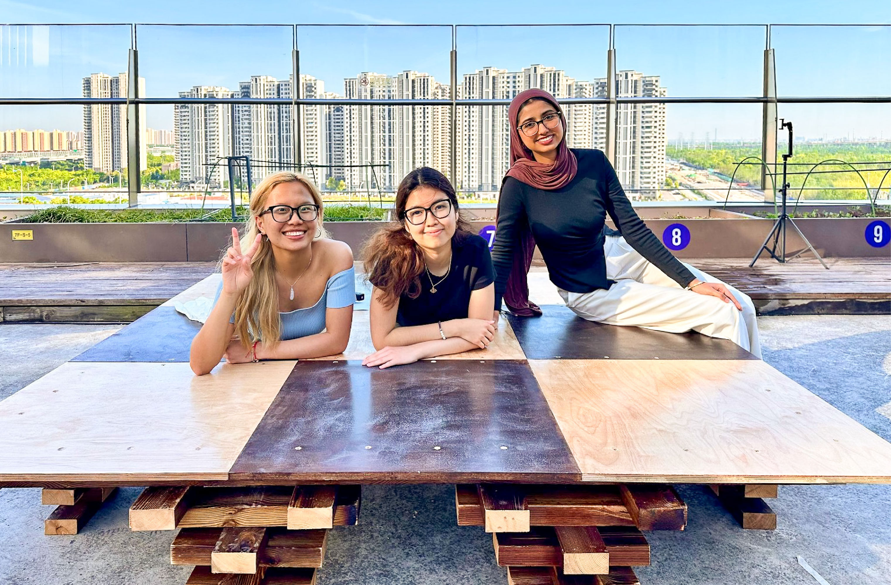 From left to right: Ada Lian, Adeliya Aitpayeva, Fatima Kazim with their design “All in One Platform”