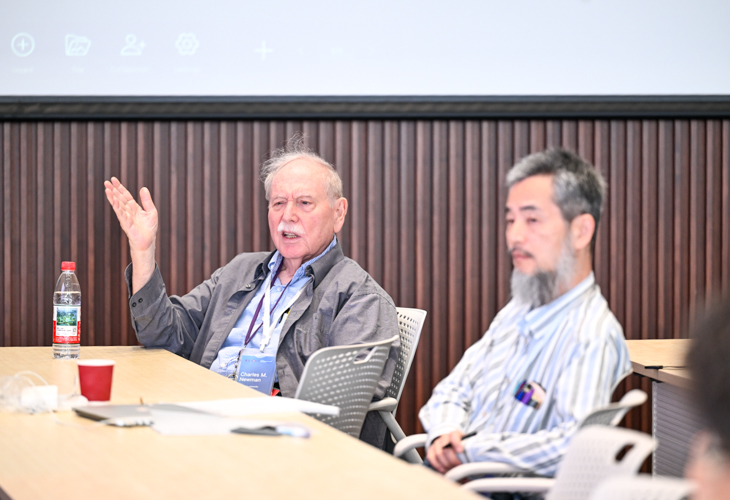 Professor Newman (left) on the meeting