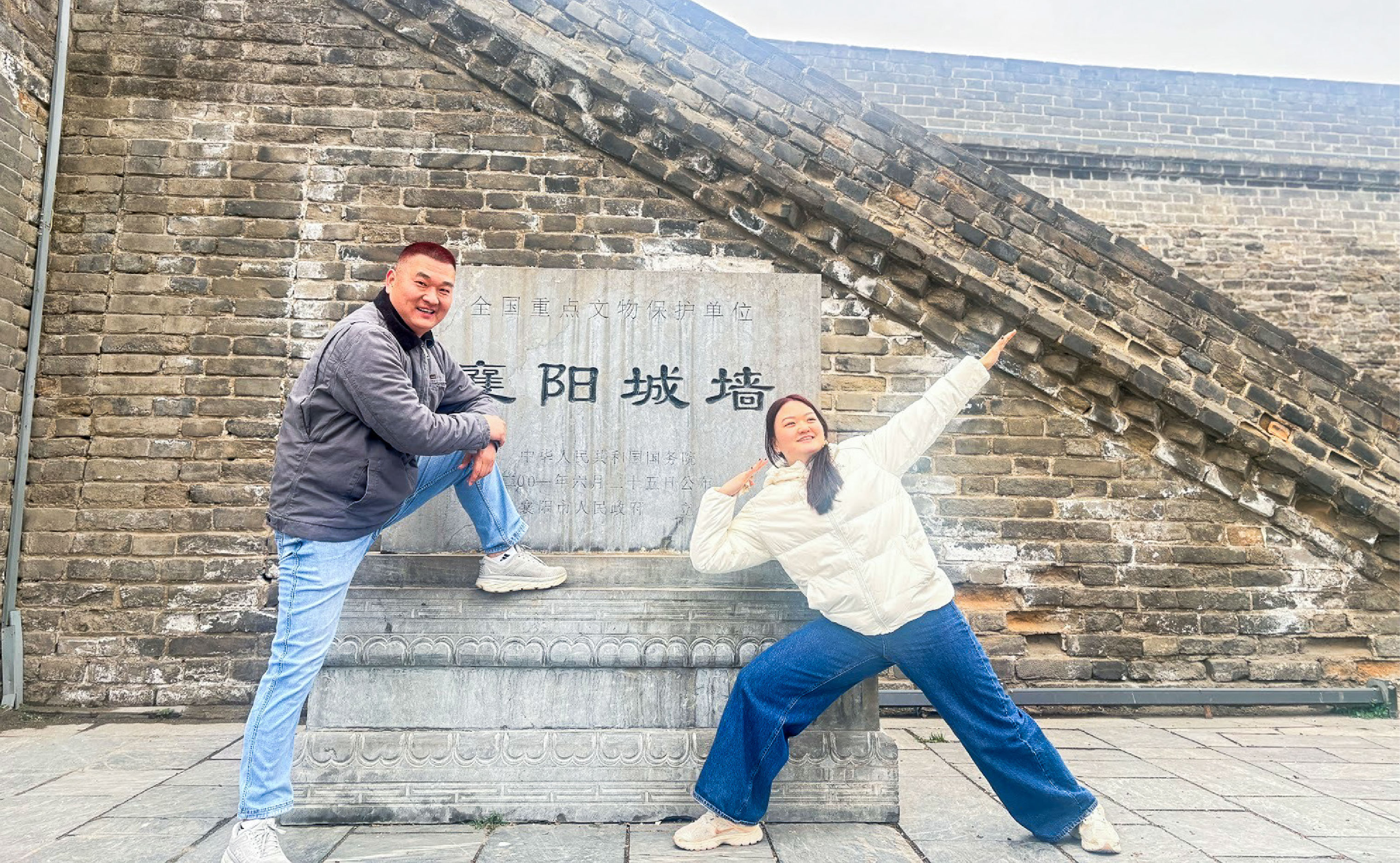 Emma Zhang ’27 poses outside of the ancient city wall in Xiangyang, Hubei with her dad.