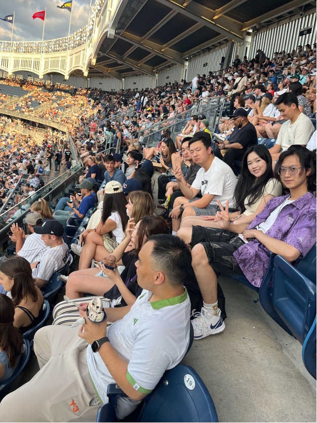 Students watching the baseball game at Yankee Stadium.