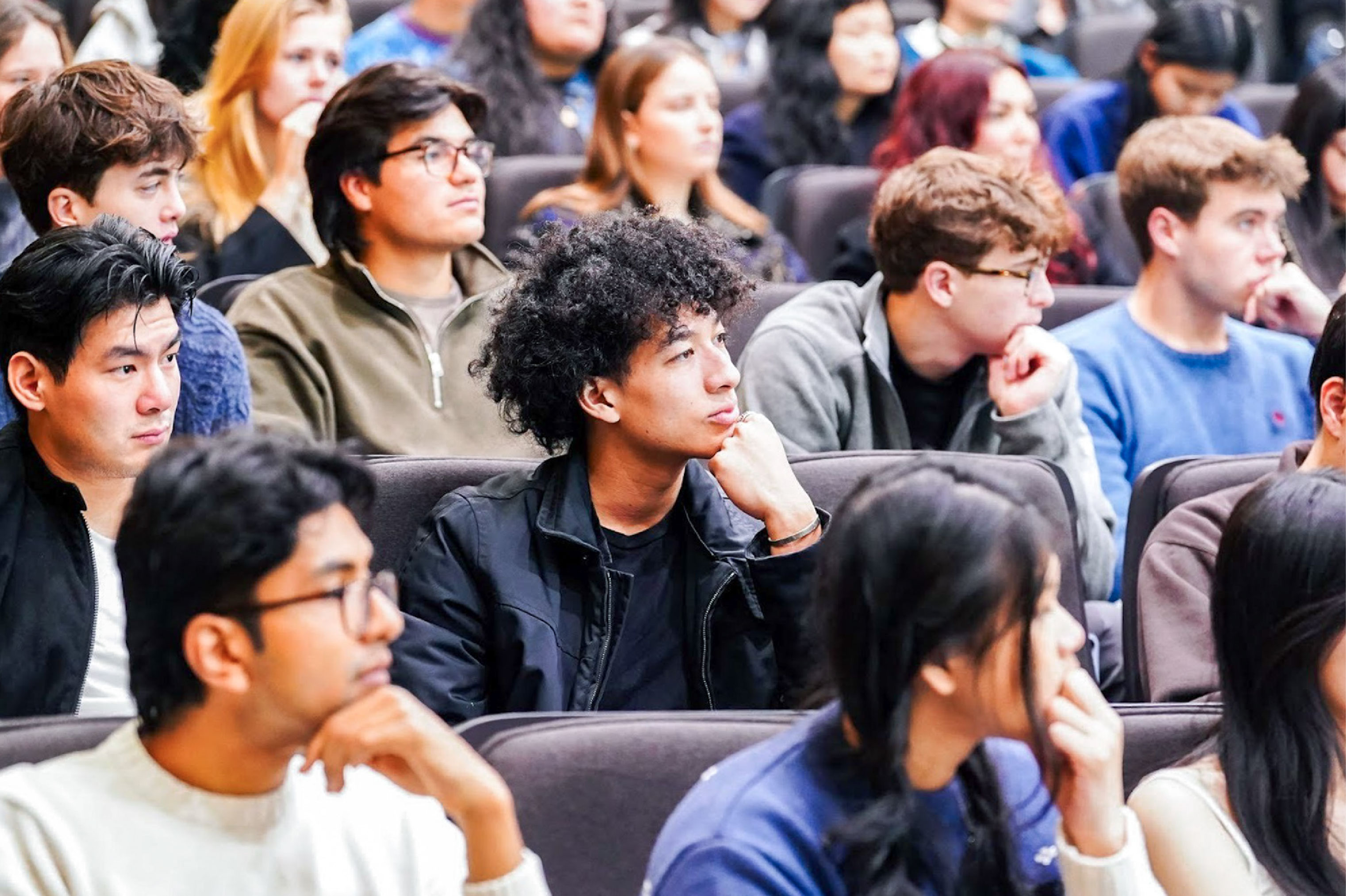 study away students listening at orientation