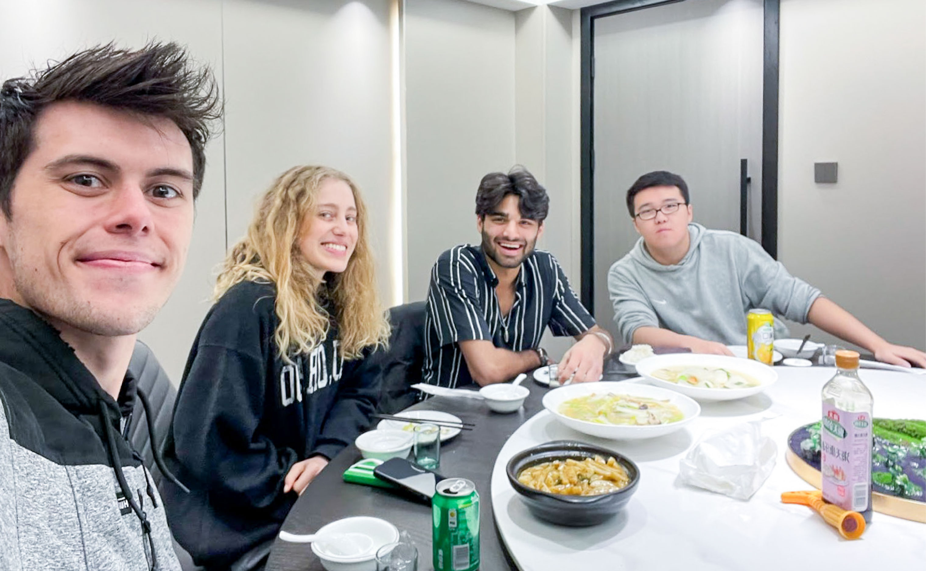 students eating dinner with friends