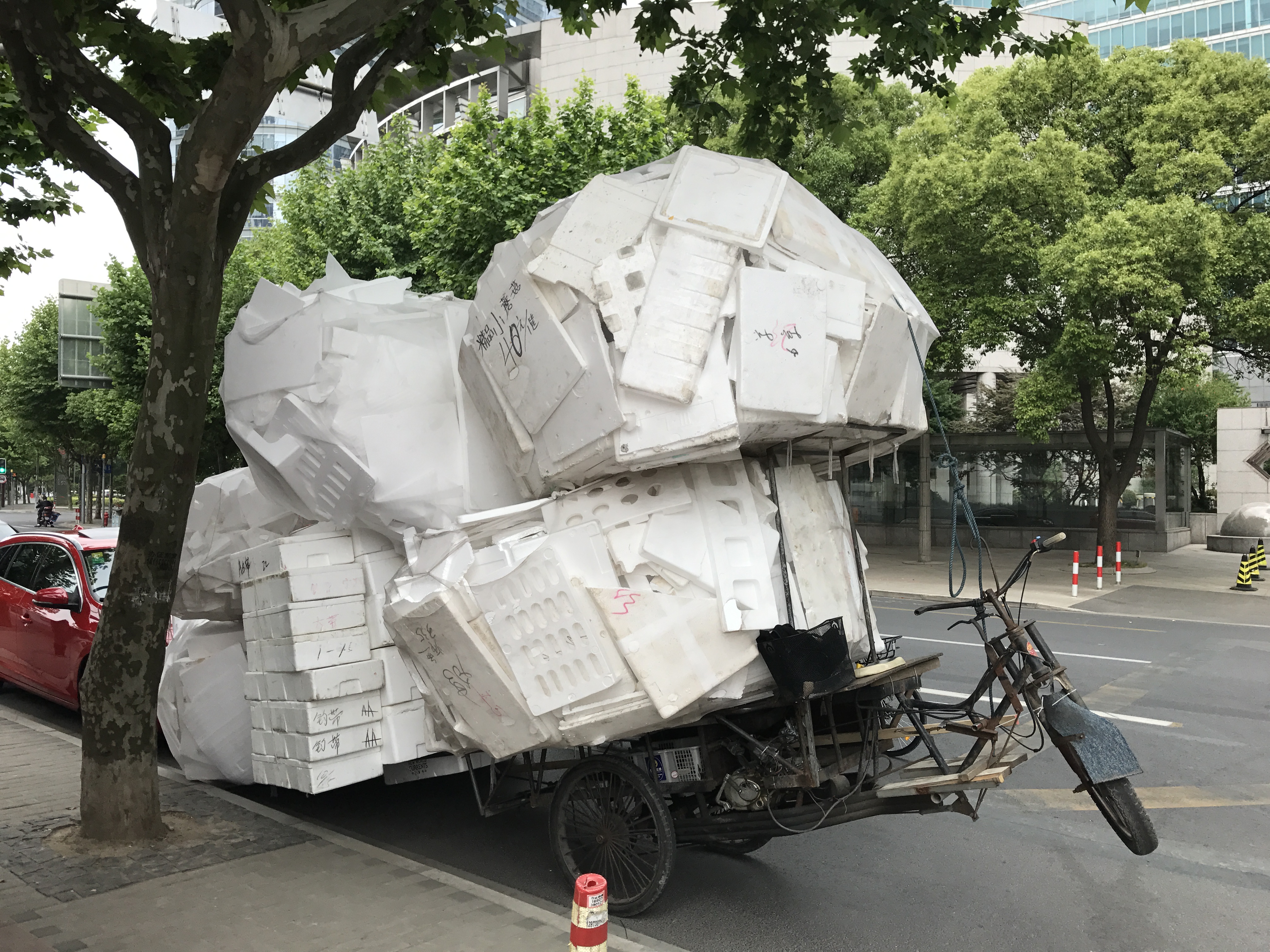 Flatbed tricycle stacked with styrofoam waste