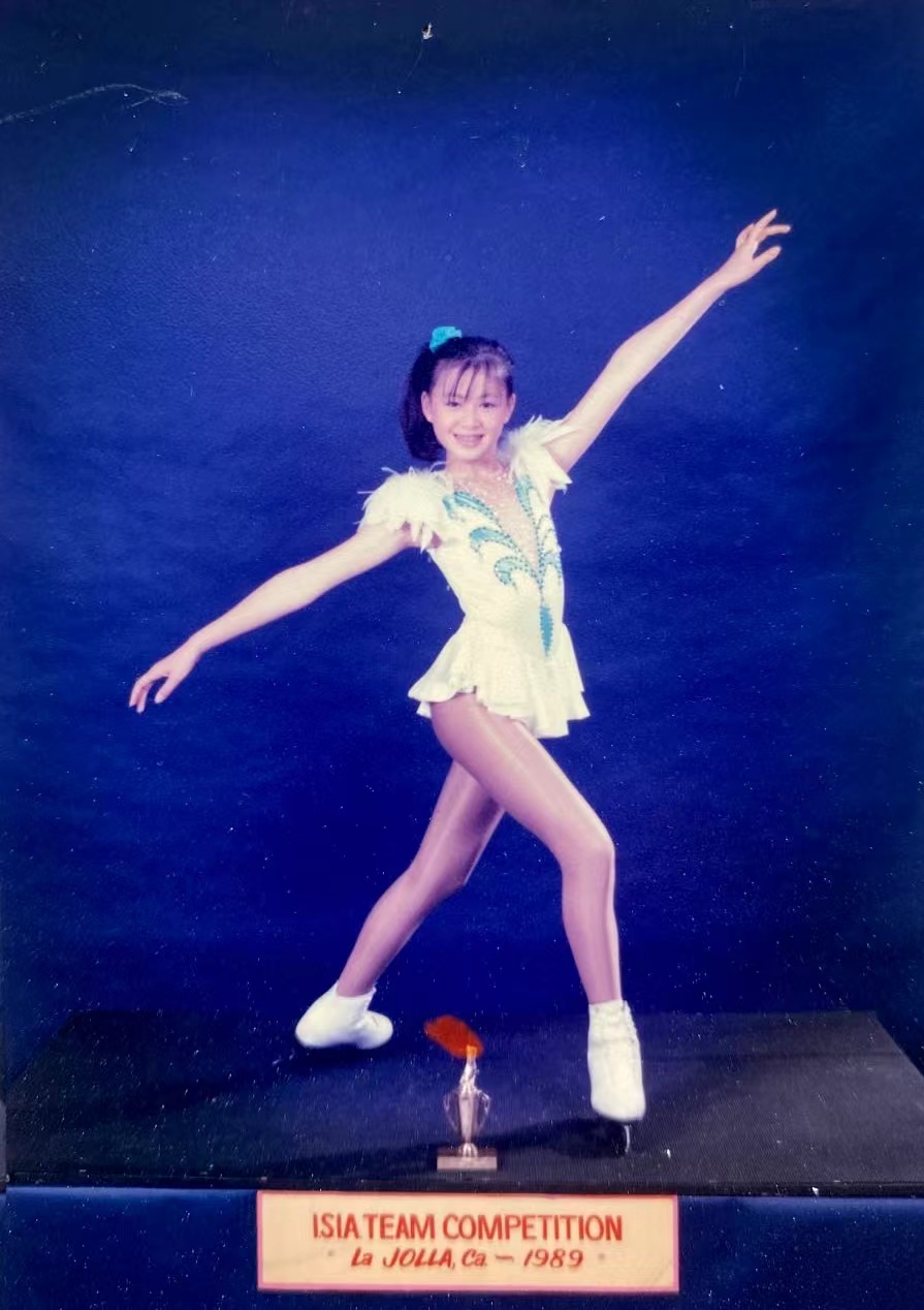 Annie Liu posing in her figure skating outfit
