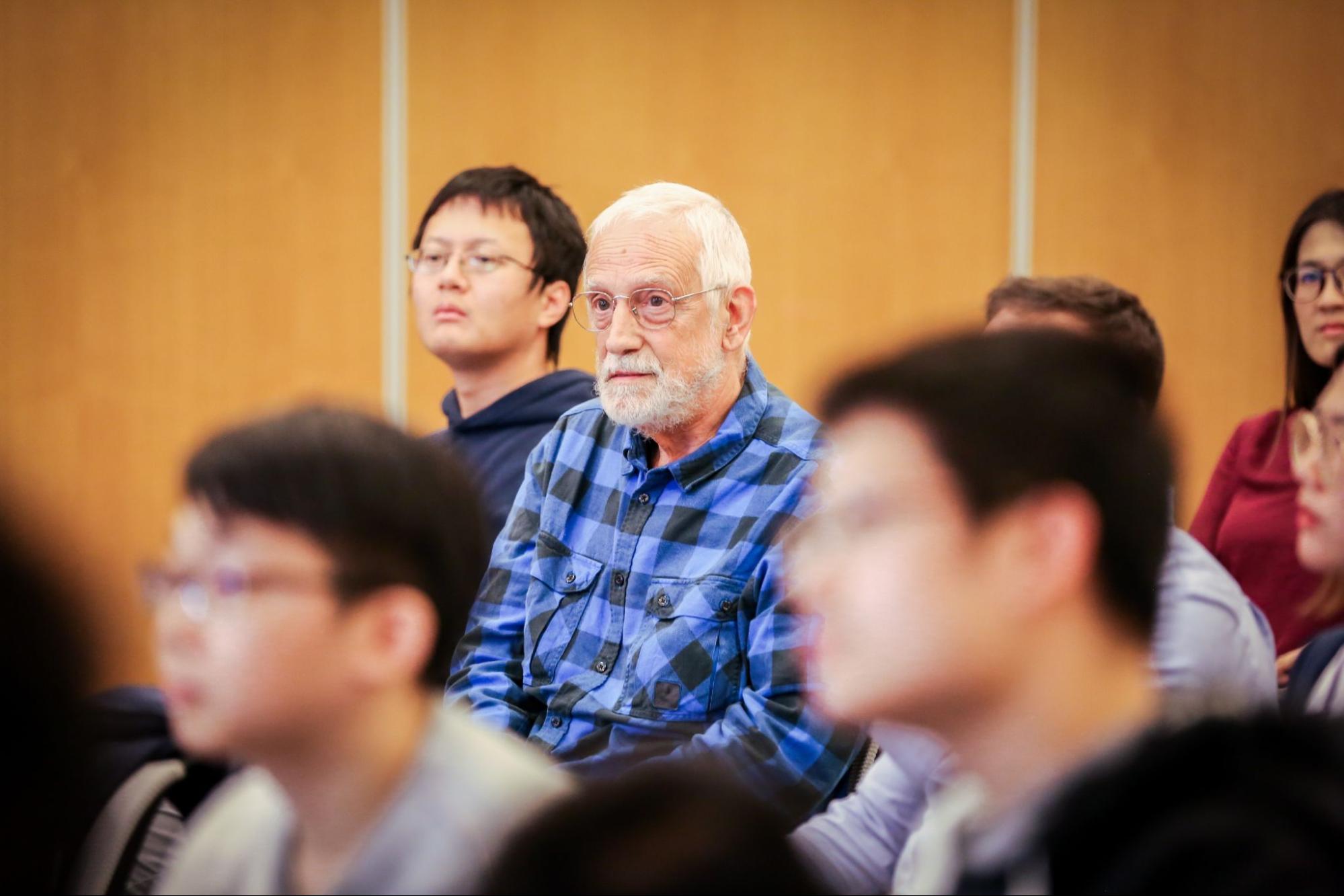 Audience members sitting and listening to the presentations 