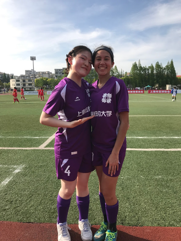 Deng and Fontalvo in violet uniforms on field