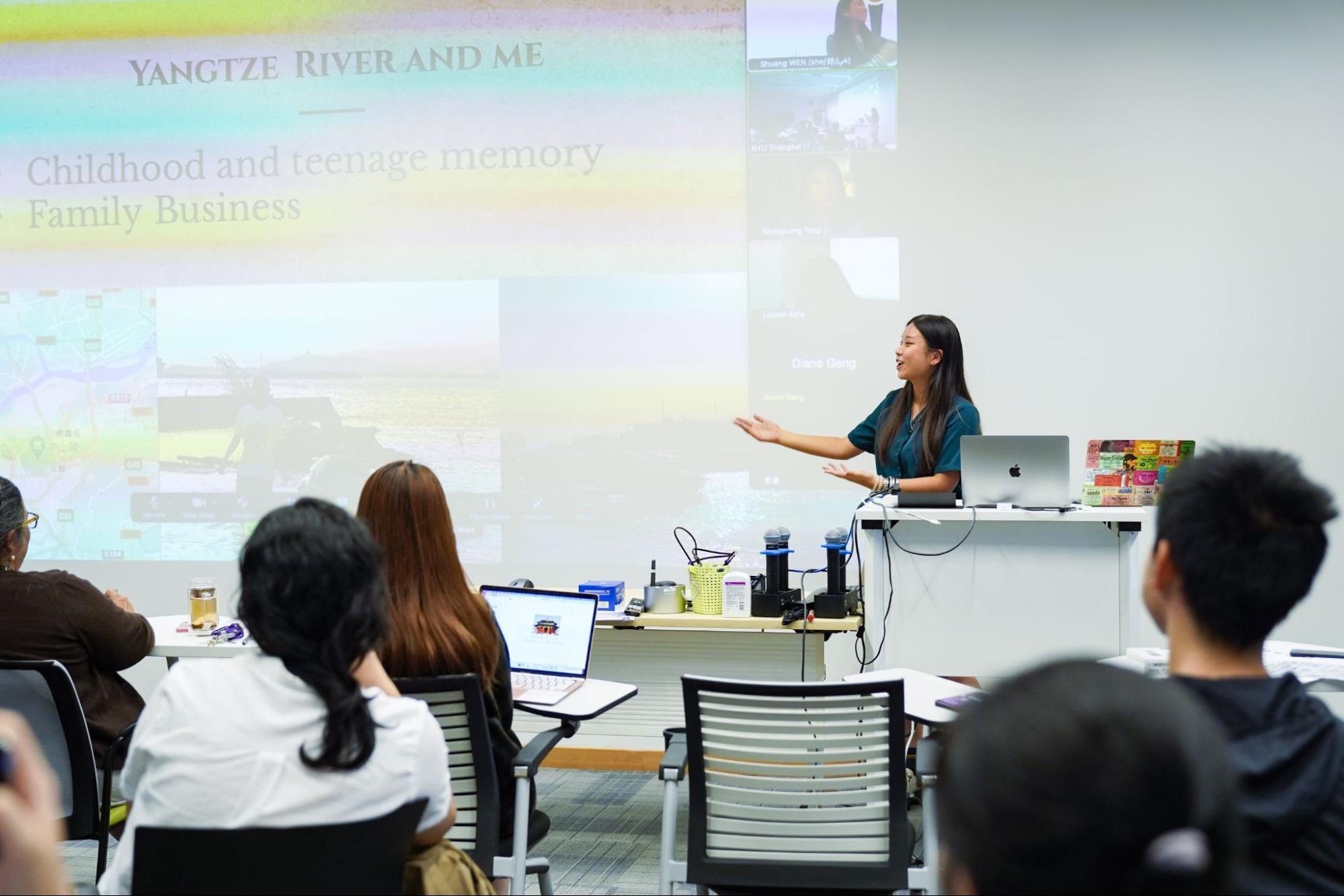 Doris Zhang standing at the front of the room giving her presentation 