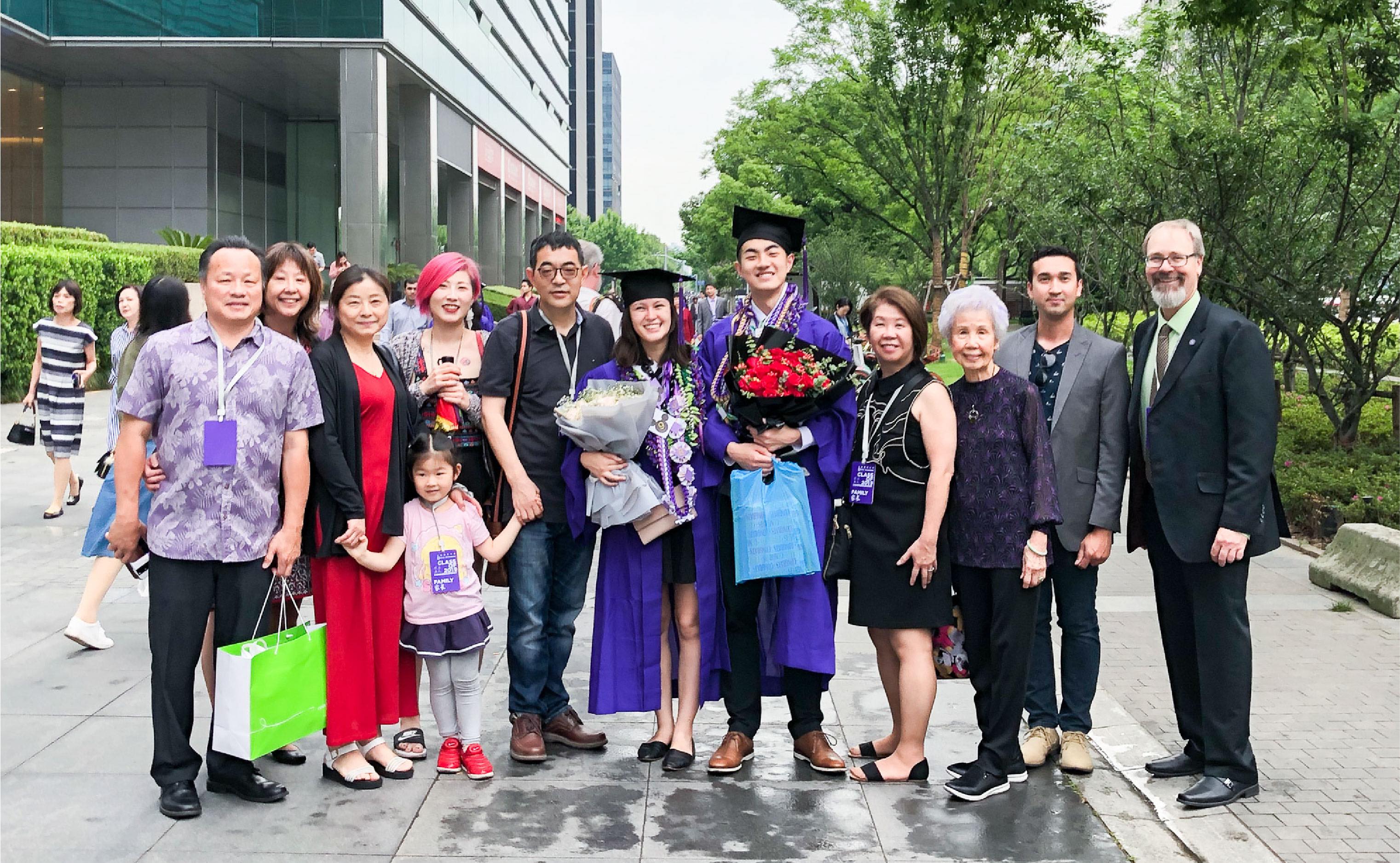 Sabrina and ZJ's families meeting during their graduation ceremony