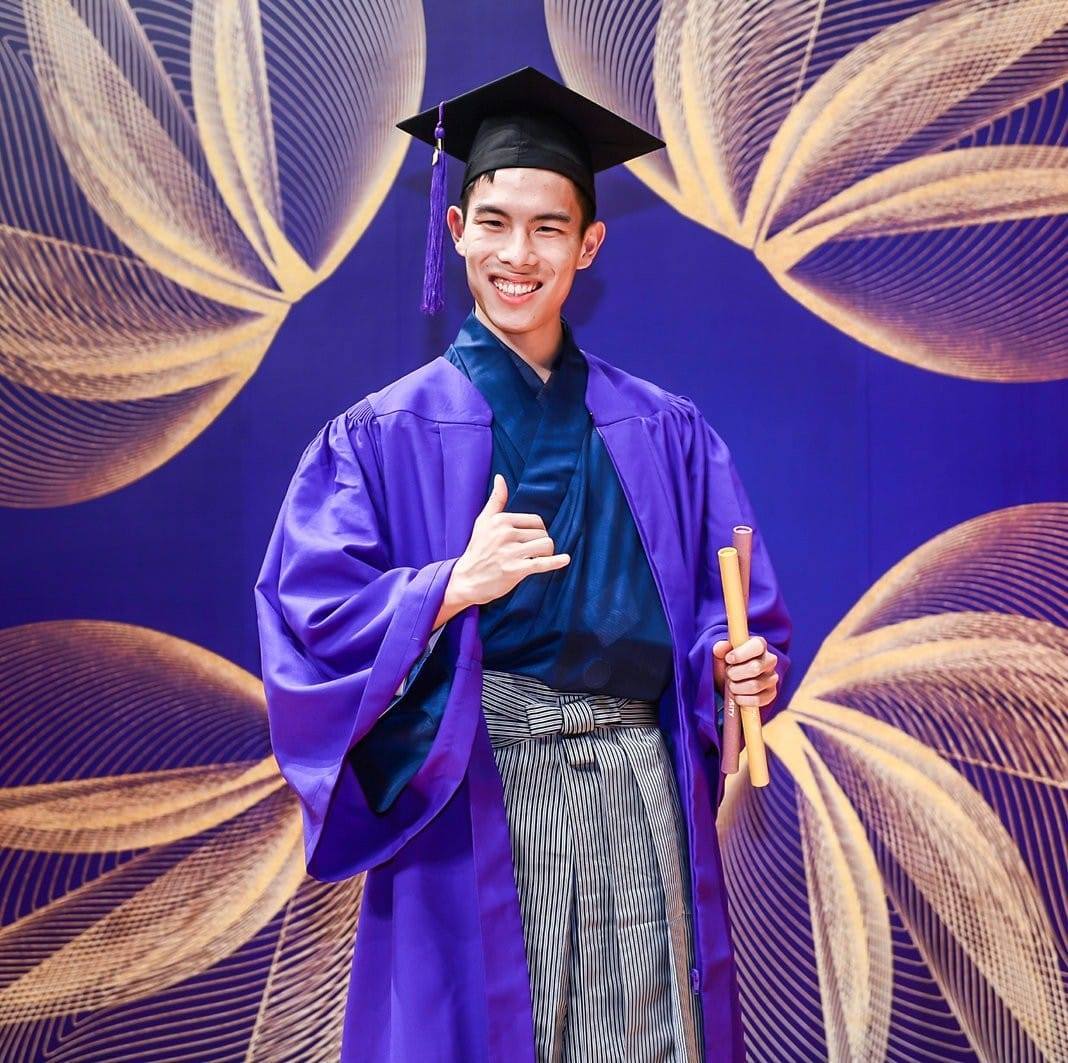 Sayama poses with his diploma at NYU Shanghai's 2019 graduation celebration