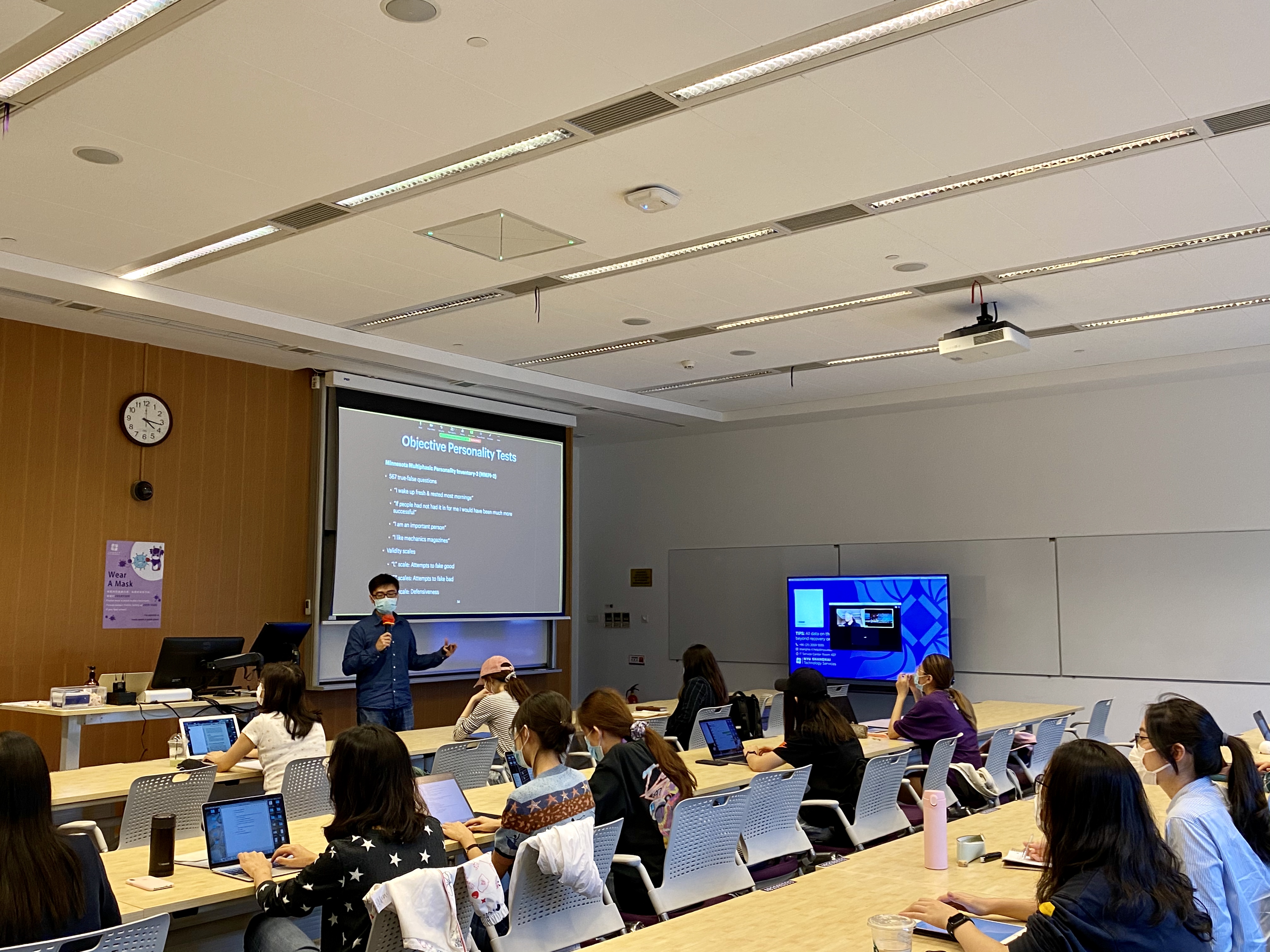 Professor Li stands at the front of the classroom