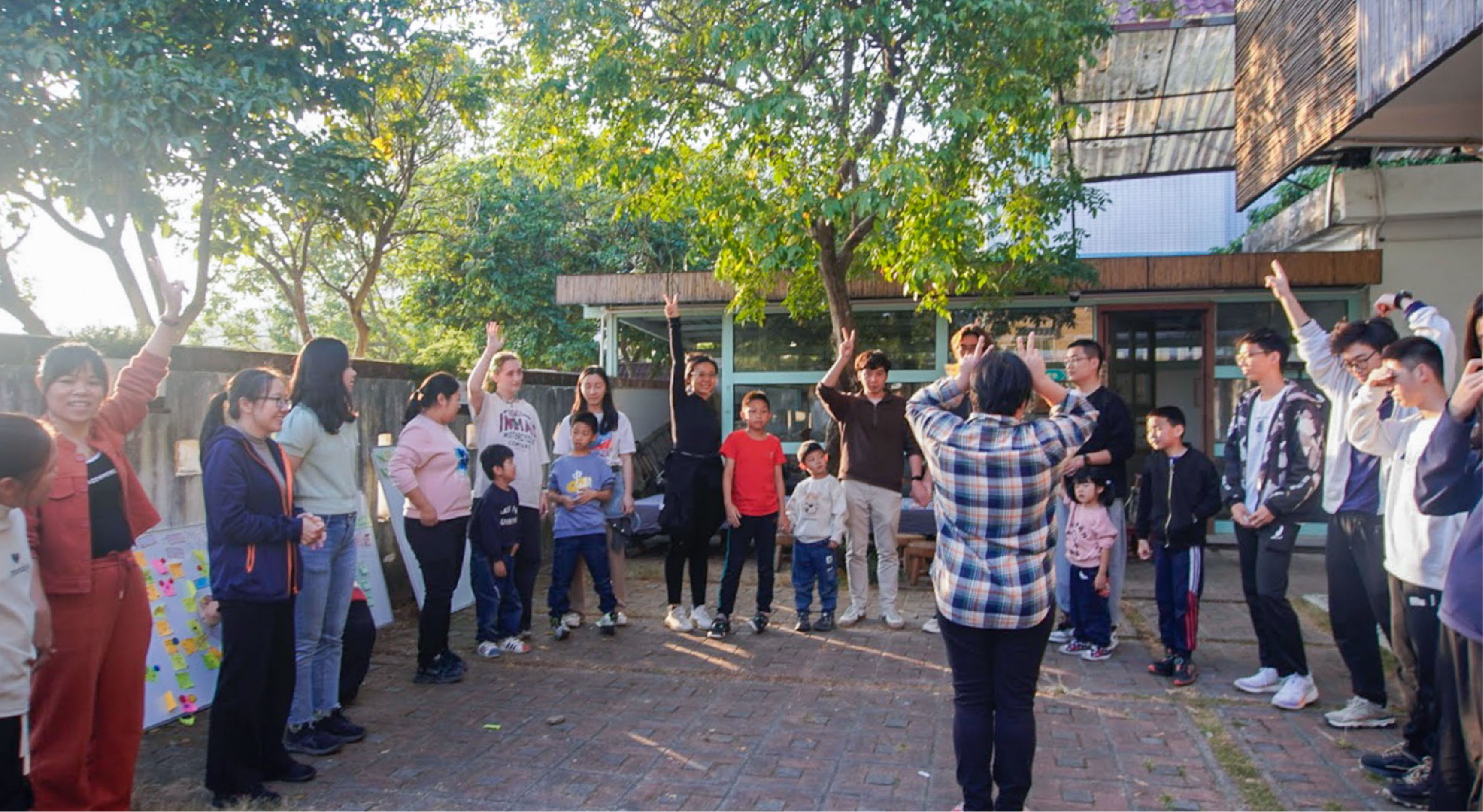 Students taking part in an interactive group activity outside in Guangdong Province.