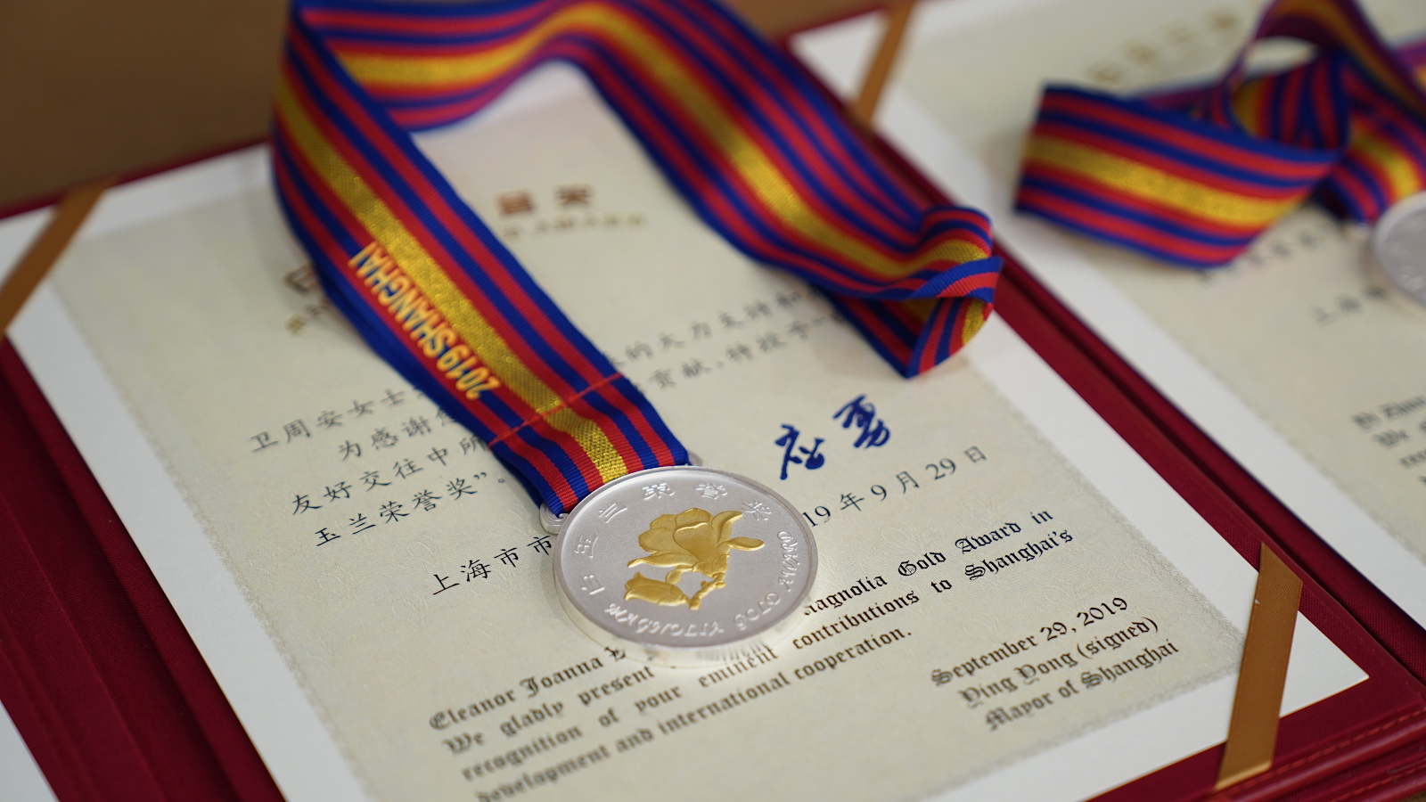 Joanna Waley-Cohen’s award certificate and medal of Gold Magnolia Award