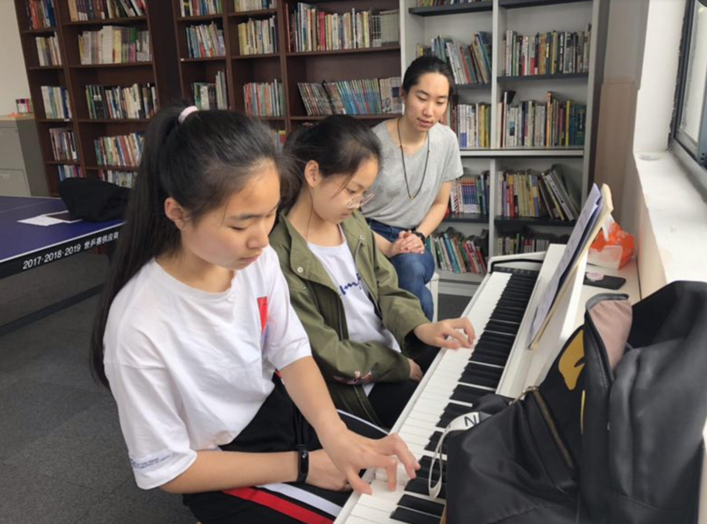 Li teaches piano