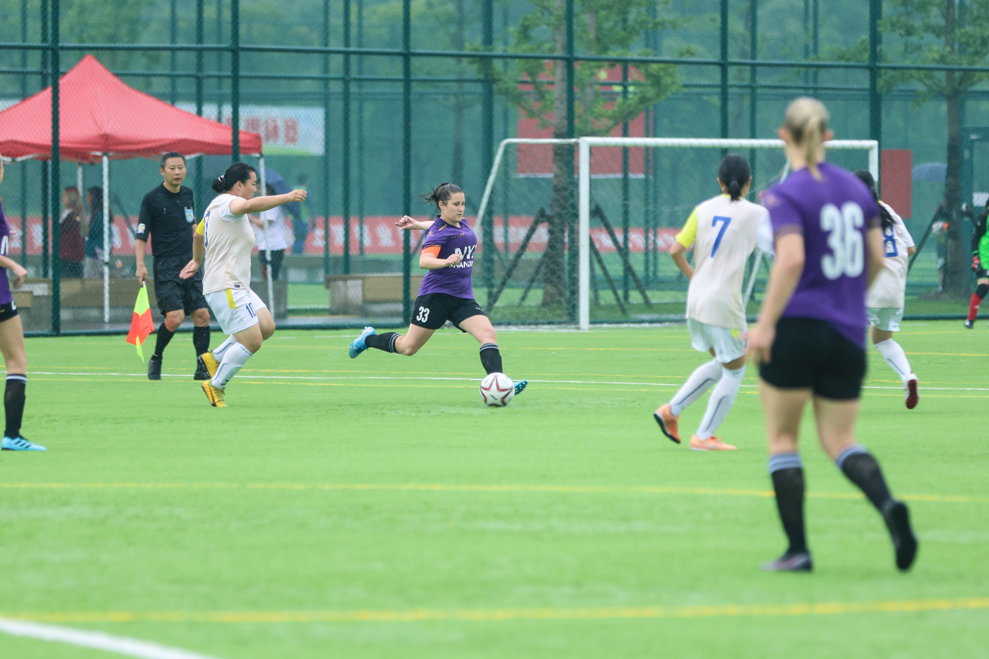 Stephanie Anderson clears the ball from the back