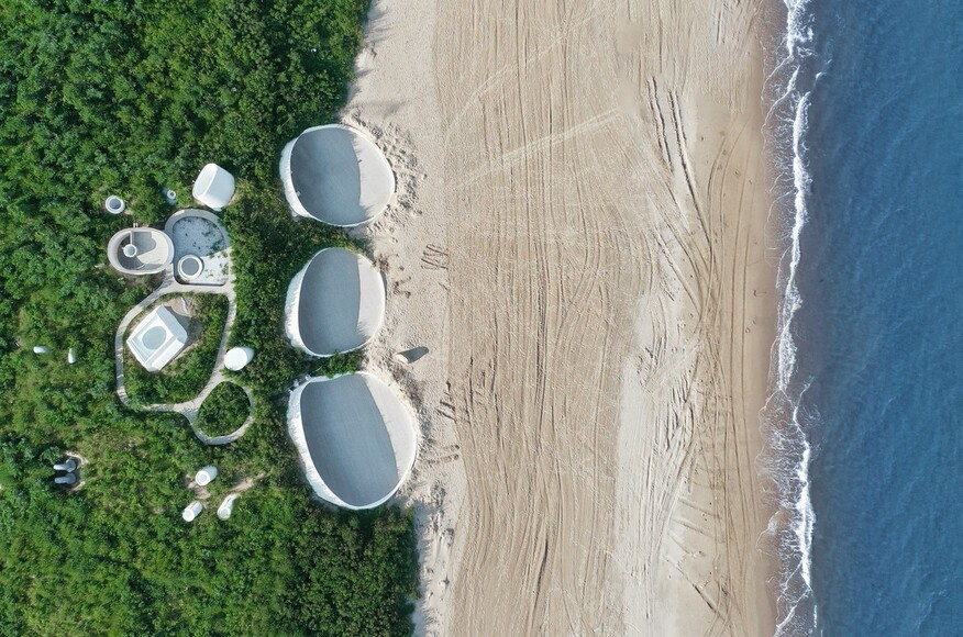 A shot from above of UCCA Dune's museum on the beach 