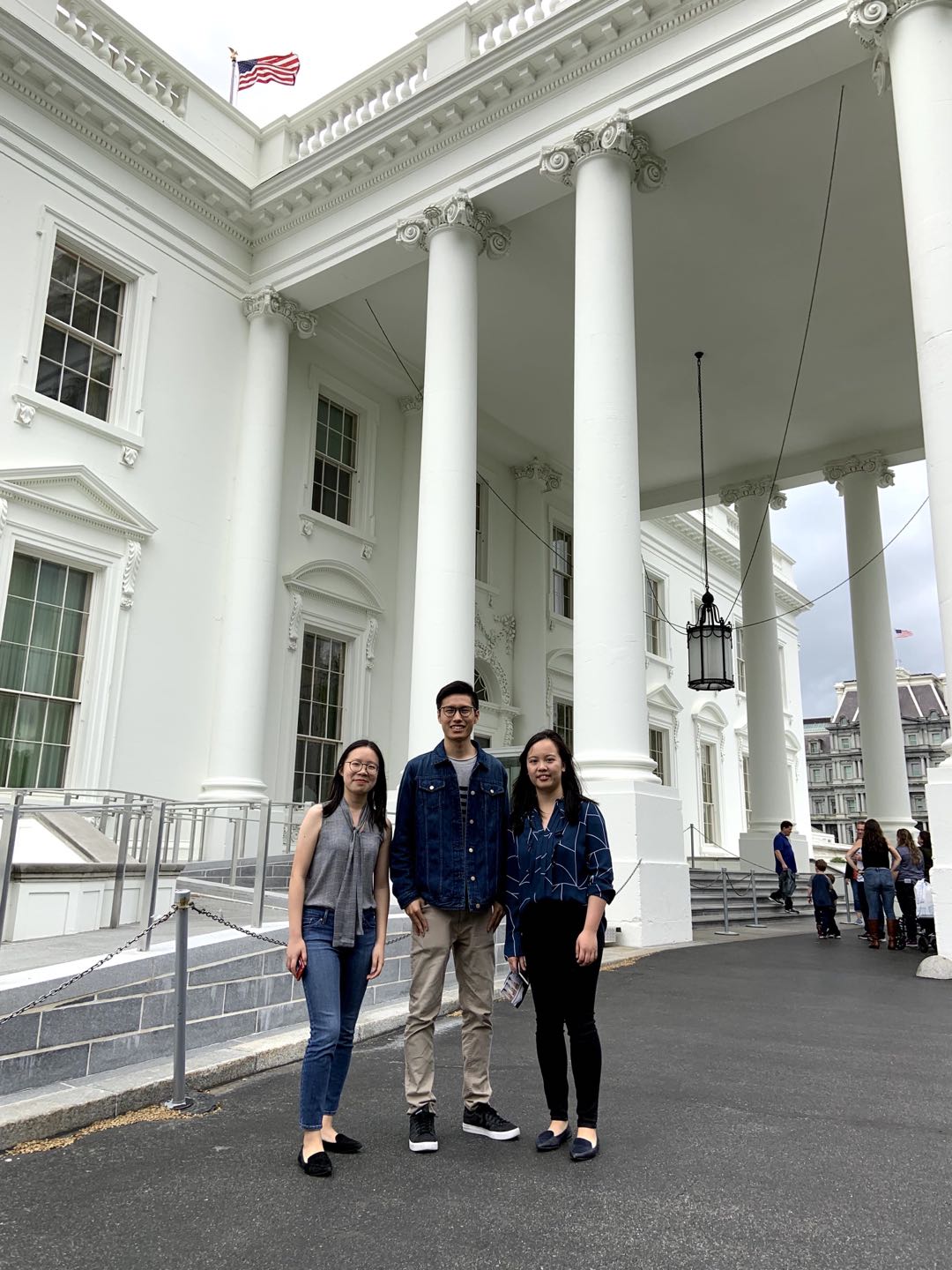 Students stand under White House portico