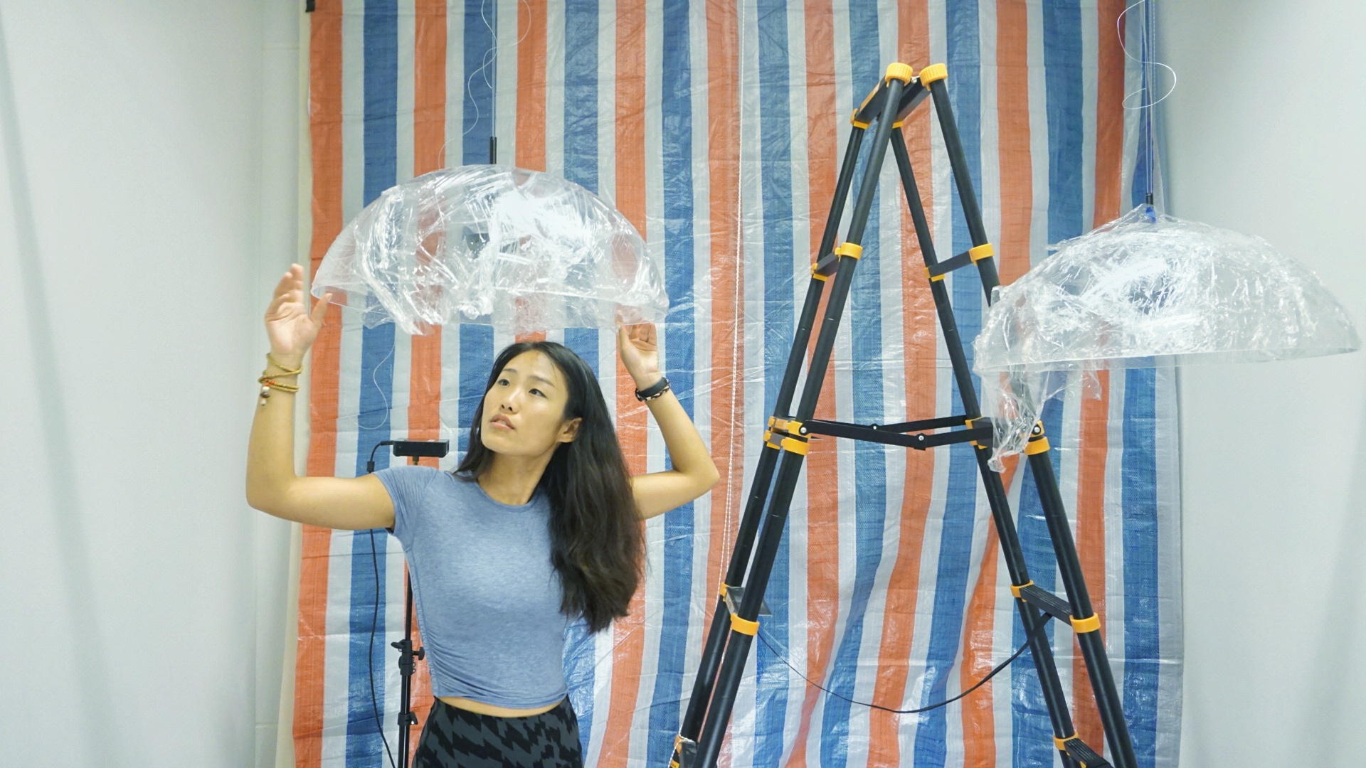 Kong installing her senior capstone project, which is a sound-art installation