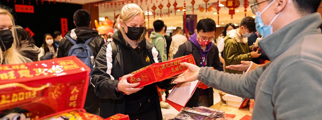 Student receives Chinese New Year gift bag