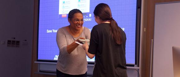 Professor awarding a student