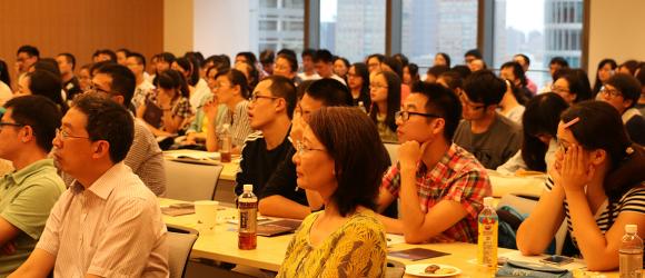 A group of students attentively listening