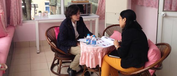 Two people having a discussion over a table