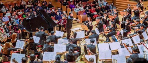 The orchestra with Bright Sheng conducting