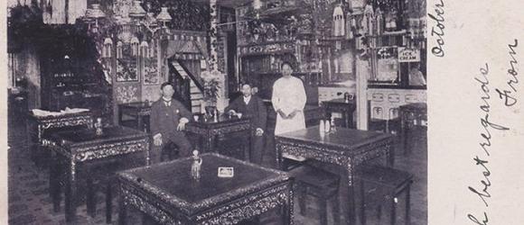 Historical photo of richly decorated Chinese restaurant in late 19th century