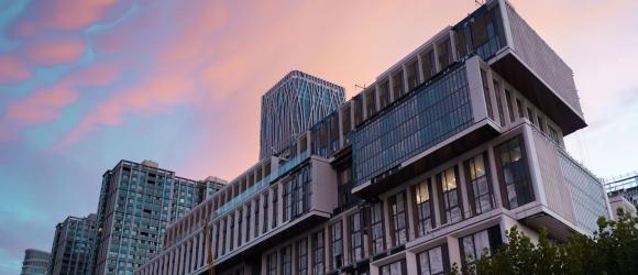 a pink sunset behind qiantan