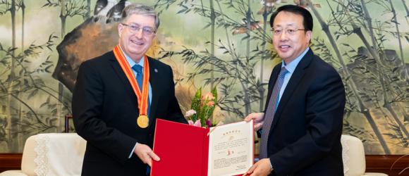 Lehman accepting an award with Mayor Gong