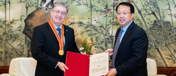 Lehman accepting an award with Mayor Gong
