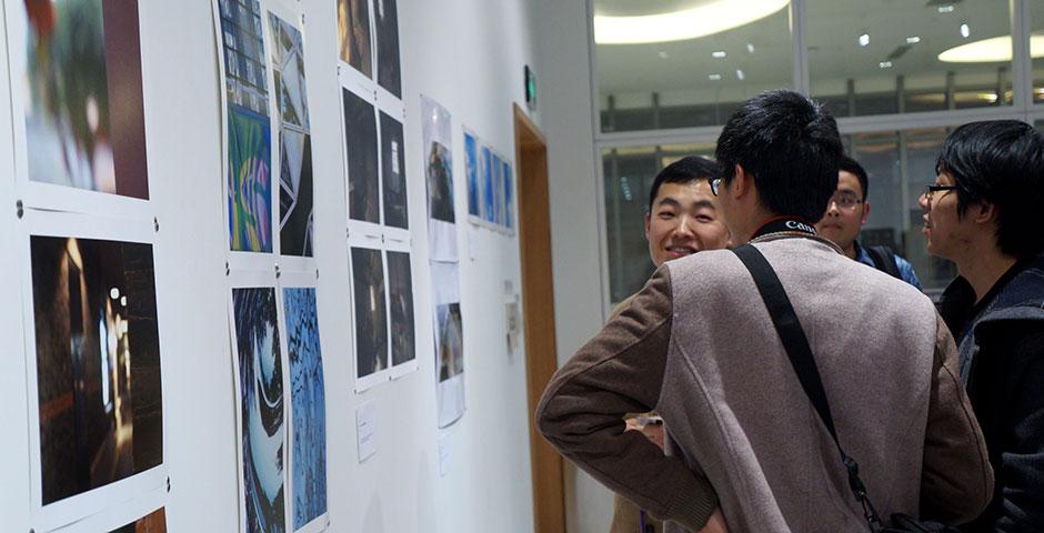 Professors Barbara Edelstein and Jian-Jun Zhang join their students in showcasing &quot;Image Ination,&quot; an exhibit of original student photography compositions. December 10, 2014. (Photo by Charlotte San Juan)