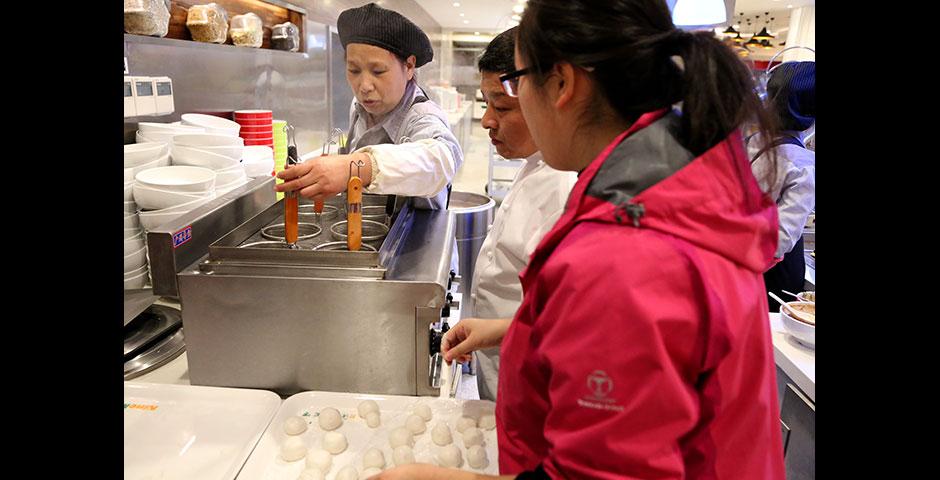 In honor of China's annual Lantern Festival, which marks the last day of Lunar New Year celebrations, students participate in paper cutting, learn Chinese calligraphy, and cook traditional tangyuan (汤圆). March 5, 2015. (Photo by Sunyi Wang)