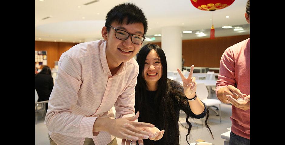 In honor of China's annual Lantern Festival, which marks the last day of Lunar New Year celebrations, students participate in paper cutting, learn Chinese calligraphy, and cook traditional tangyuan (汤圆). March 5, 2015. (Photo by Sunyi Wang)