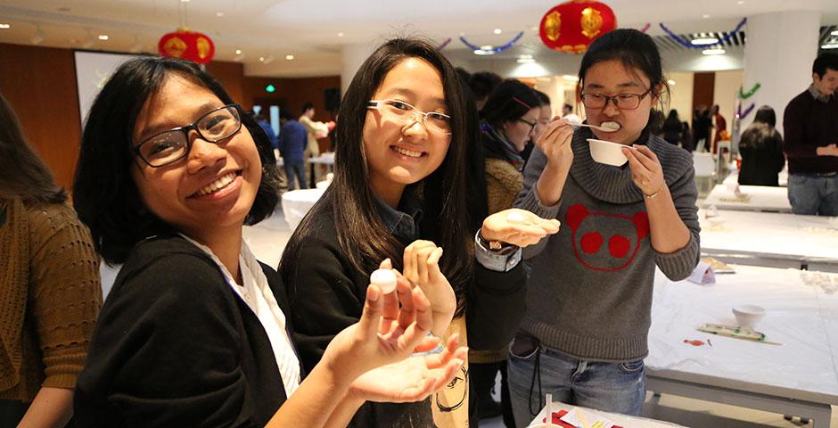 In honor of China's annual Lantern Festival, which marks the last day of Lunar New Year celebrations, students participate in paper cutting, learn Chinese calligraphy, and cook traditional tangyuan (汤圆). March 5, 2015. (Photo by Sunyi Wang)