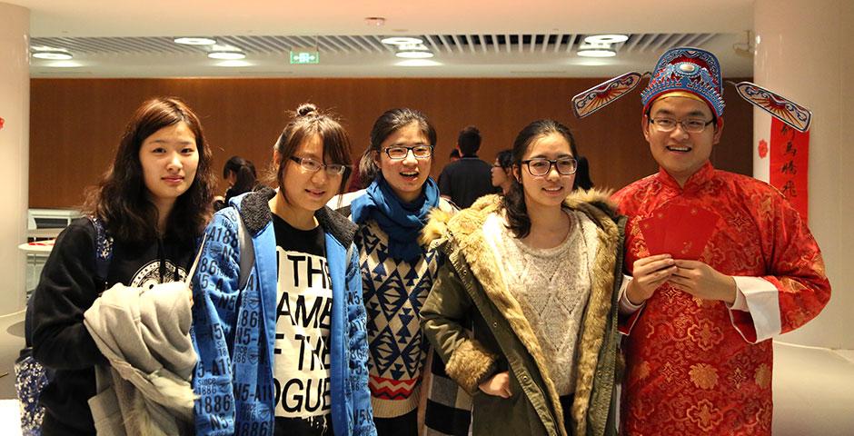 In honor of China's annual Lantern Festival, which marks the last day of Lunar New Year celebrations, students participate in paper cutting, learn Chinese calligraphy, and cook traditional tangyuan (汤圆). March 5, 2015. (Photo by Sunyi Wang)