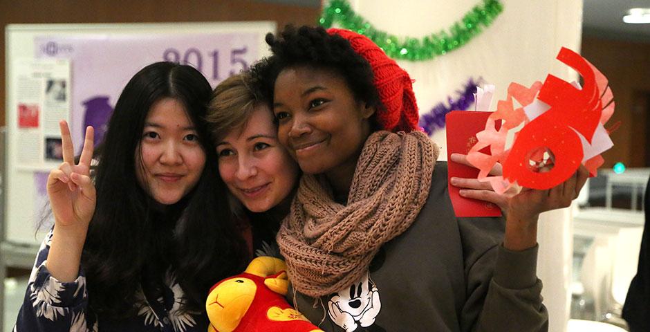 In honor of China's annual Lantern Festival, which marks the last day of Lunar New Year celebrations, students participate in paper cutting, learn Chinese calligraphy, and cook traditional tangyuan (汤圆). March 5, 2015. (Photo by Sunyi Wang)