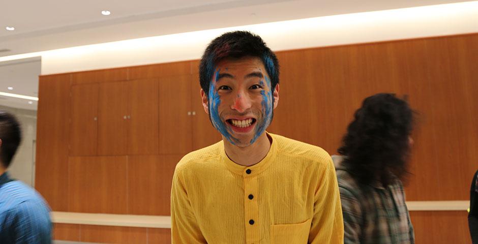 To celebrate Holi Festival, a Hindu festival with colored powder and water fights, the Food and Festivals Club dusts students' faces with colored chalk. March 6, 2015. (Photo by Annie Seaman)