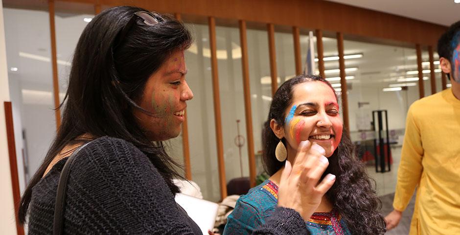 To celebrate Holi Festival, a Hindu festival with colored powder and water fights, the Food and Festivals Club dusts students' faces with colored chalk. March 6, 2015. (Photo by Annie Seaman)