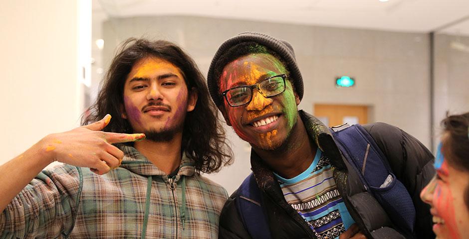 To celebrate Holi Festival, a Hindu festival with colored powder and water fights, the Food and Festivals Club dusts students&#039; faces with colored chalk. March 6, 2015. (Photo by Annie Seaman)