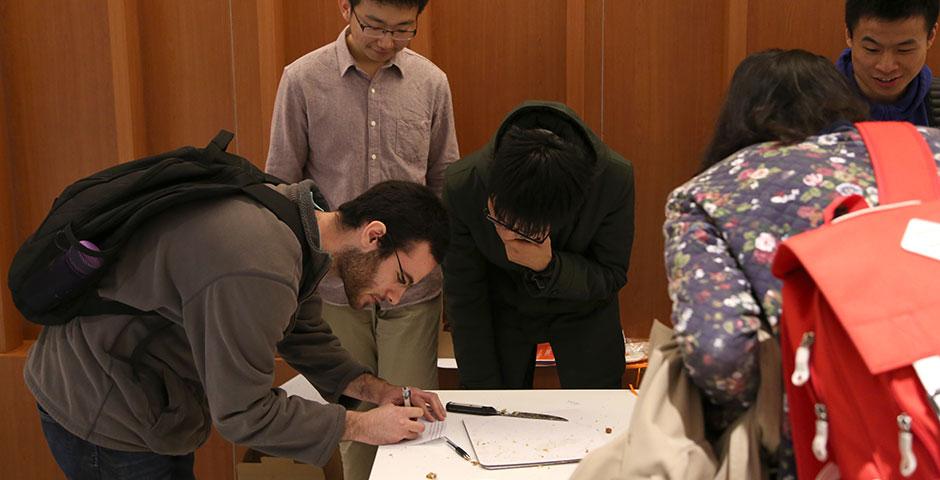 To celebrate Pi Day 2015, Math Society awarded slices of pie to students who could recite over 11 digits of pi. Congratulations to Omer Cohen (207 digits), Ziyuan Huang (100 digits), and Siyao Fang (83 digits), who placed first, second, and third, respectively. March 16, 2015. (Photo by Sunyi Wang)