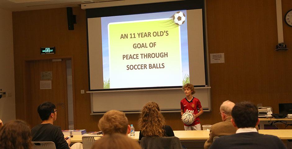 As part of Ally Week 2015, young soccer fan and player Mac Millar speaks at NYU Shanghai on promoting peace through his favorite sport. April 13, 2015. (Photo by Annie Seaman)