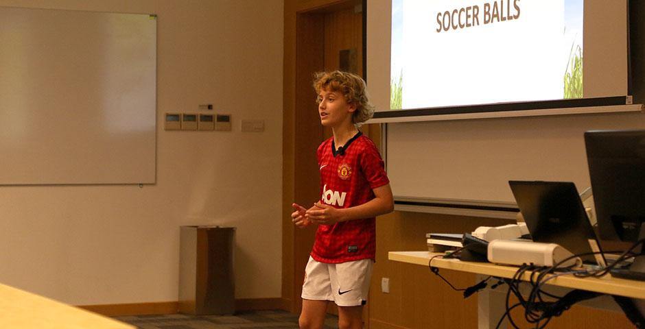 As part of Ally Week 2015, young soccer fan and player Mac Millar speaks at NYU Shanghai on promoting peace through his favorite sport. April 13, 2015. (Photo by Annie Seaman)