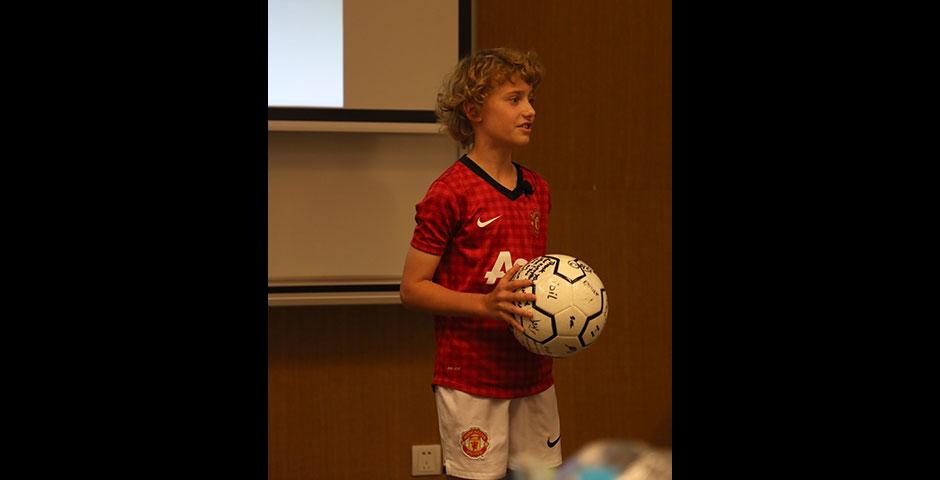 As part of Ally Week 2015, young soccer fan and player Mac Millar speaks at NYU Shanghai on promoting peace through his favorite sport. April 13, 2015. (Photo by Annie Seaman)