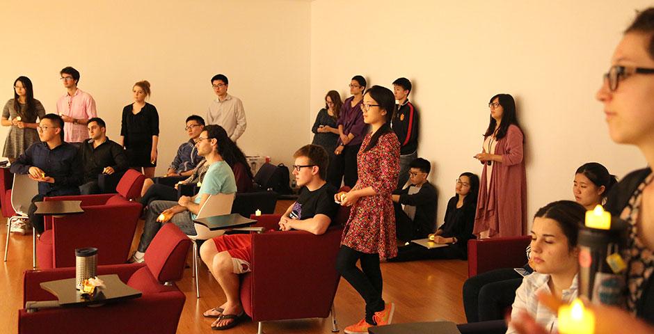 The NYU Shanghai community honors those impacted by the devastating Nepal earthquake with a candlelight vigil and a benefit event hosted in conjunction with the Rotary of Shanghai. May 4, 2015. (Photo by Sunyi Wang)