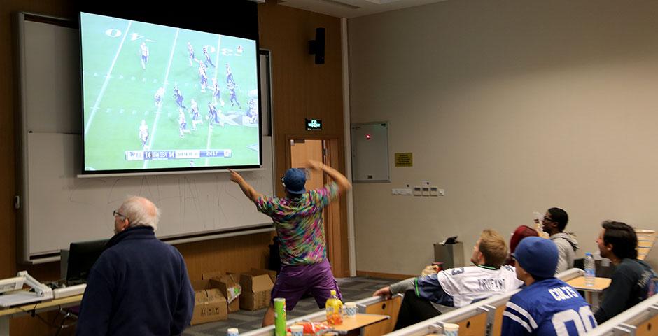 Students and faculty gathered bright and early to cheer on the Seahawks and Patriots for Super Bowl XLIX. February 2, 2015. (Photo by Annie Seaman)