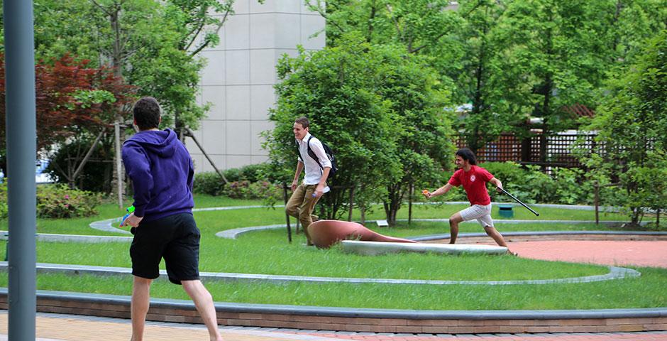Students wrap up Stressbusters Week with an outdoor fiesta of watergun fights, pizza, and music. May 16, 2015. (Photo by Kevin Pham)