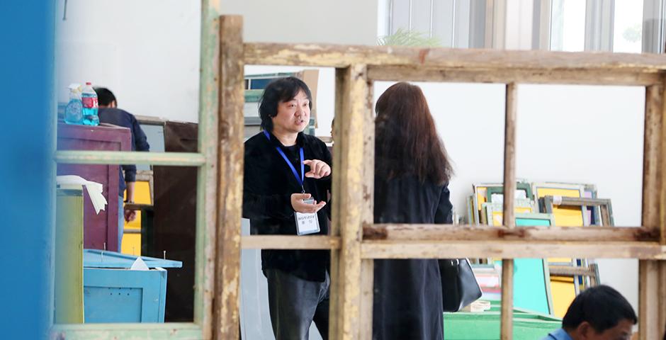 Chinese artist Song Dong's solo exhibition opening on March 11 at the NYU Shanghai Art Gallery featured a gridded installation of frames and mirrors, creating an intimate yet elliptical composite portrait.  (Photo by: NYU Shanghai)