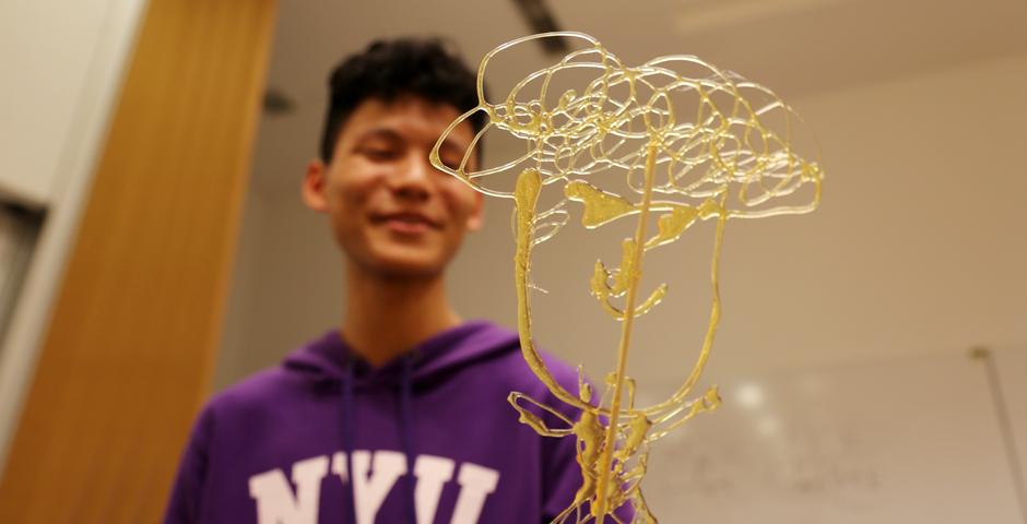 NYU Shanghai students learned the Chinese folk art of sugar painting, a craft which uses melted sugar to create traditional animal and plant figures. Two Shanghainese sugar artists instructed students at the October 26 event. (Photo by: Wenqian Hu)