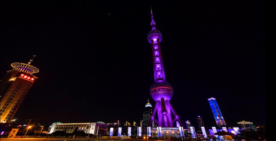 The pearl tower lit up in violet.