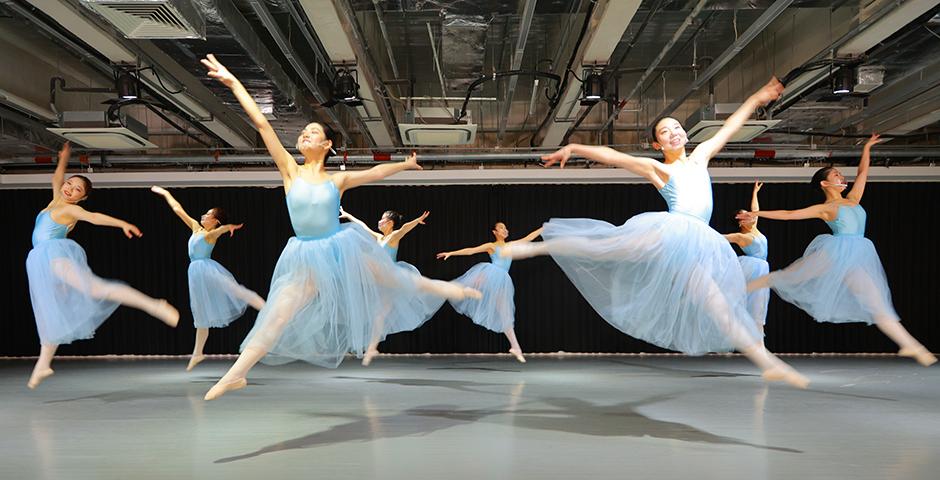 NYU Shanghai ballet students smile through plastic face shields as they leap to Tchaikovsky’s “Serenade for Strings” choreographed by George Balanchine, at the end-of-semester dance performance. “Because of the pandemic, we weren’t supposed to have physical contact during the whole semester, which meant we had to re-choreograph some movements accordingly,” says Assistant Arts Professor Tao Siye. “We wanted to call it Serenade In the Background of COVID-19.”